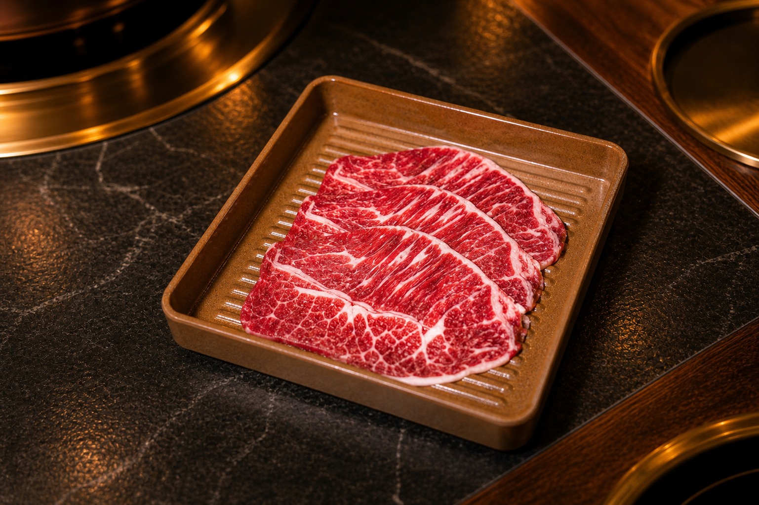 US Wagyu brisket slices on a white plate